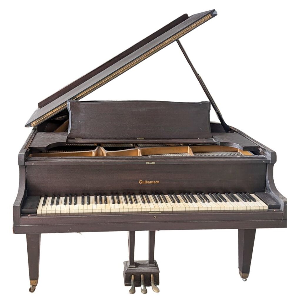 The Gulbransen baby grand in its current, original condition