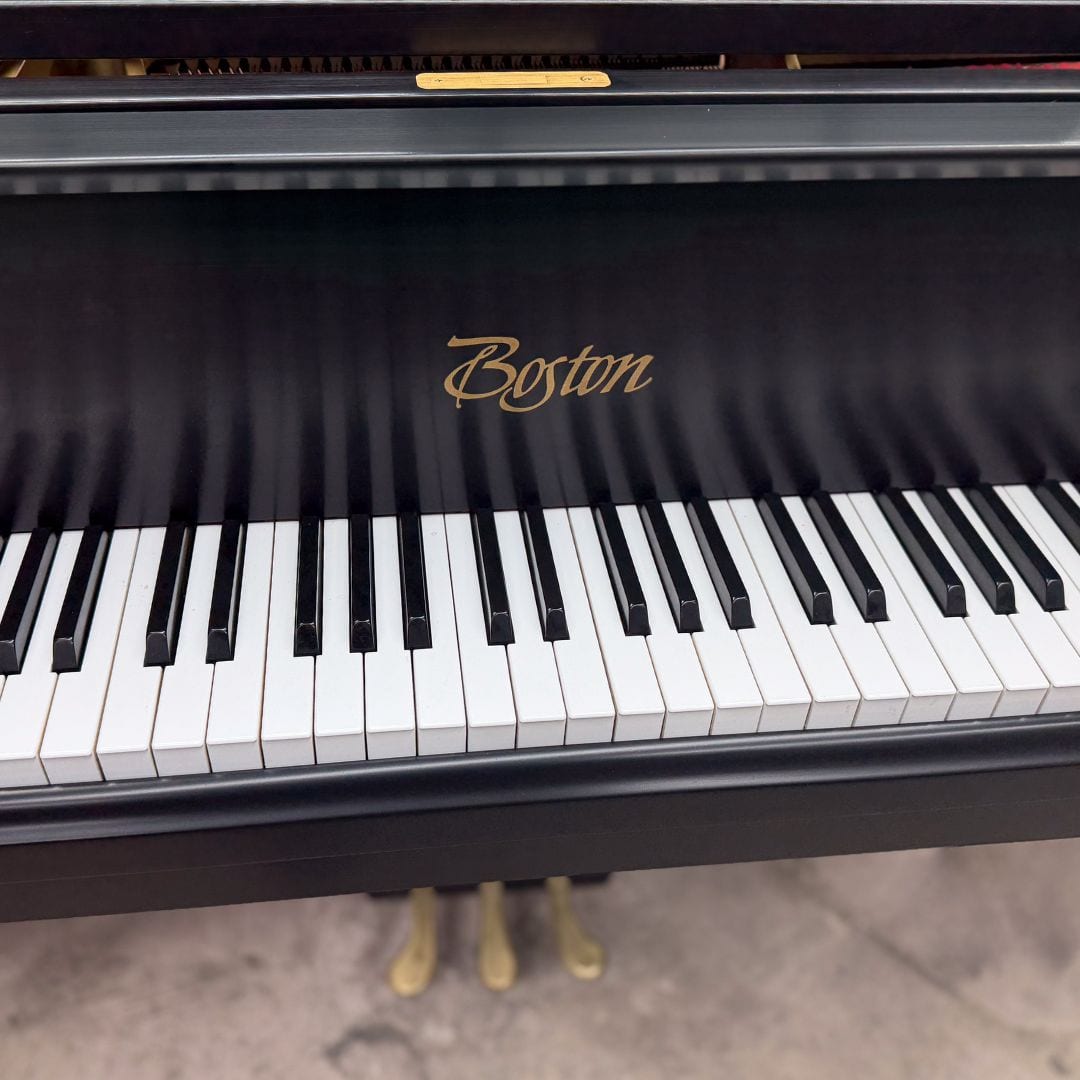 Angled view along the Boston keyboard and the gold script decal