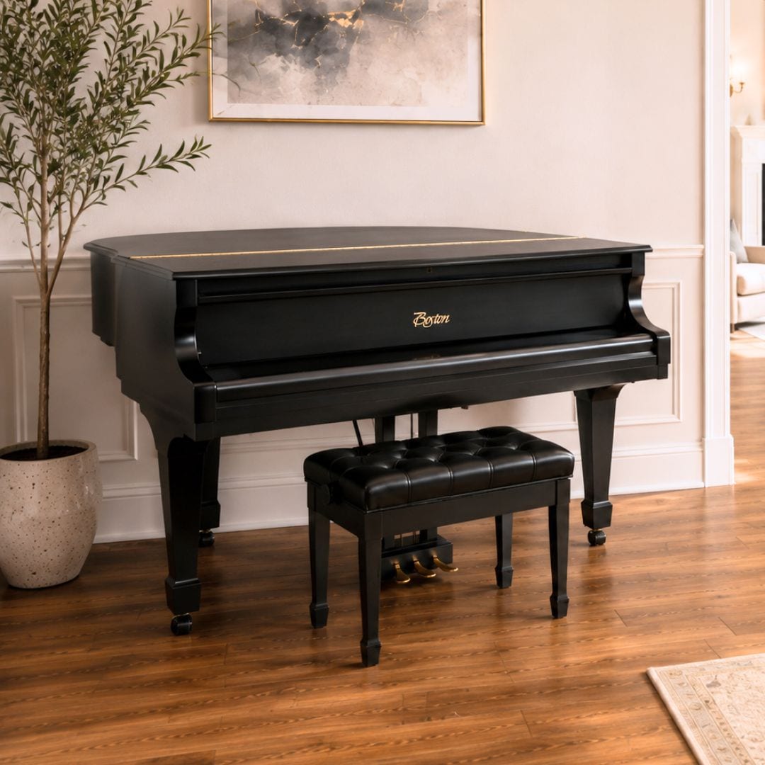 The restored Boston by Steinway grand shown in a styled living room setting